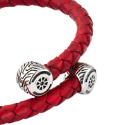  Sterling silver Formula 1 racing car bracelet red leather clasp close-up showing fully sculptural red enamel F1 open-wheel racing car with black enamel tires polished silver wings and suspension detail by Jan Leslie