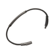 Black twisted cable bracelet with a gunmetal tube bar station, showing the secure push-pin clasp detail — a precision-engineered, low-profile closure for effortless on and off wear.