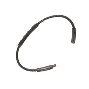 Open view of black twisted cable wire bracelet showing gunmetal bayonet push-pin clasp ends and wire segment bar detail.