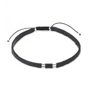 Matte black heishi bead bracelet with sterling silver tube clasp and adjustable black cord, Jan Leslie