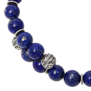 Lapis lazuli beaded stretch bracelet with engraved sterling silver filigree ball and twisted rondelle accents.