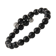 Matte black onyx beaded stretch bracelet with engraved sterling silver filigree ball and twisted rondelle accents — a bold, protective gemstone bracelet that defines effortless masculine luxury.