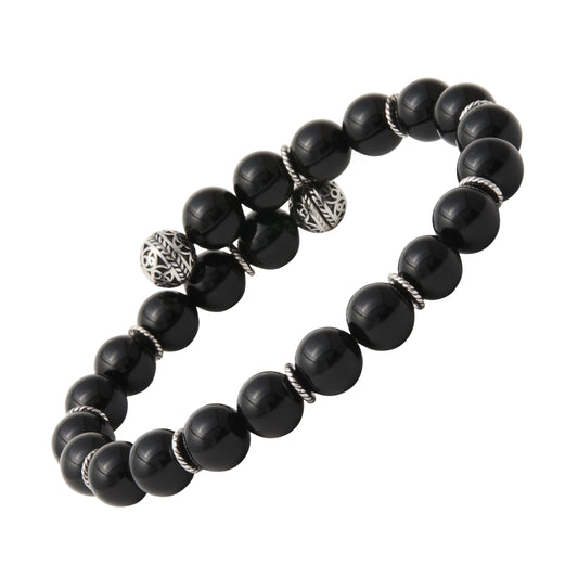 Matte black onyx beaded stretch bracelet with engraved sterling silver filigree ball and twisted rondelle accents — a bold, protective gemstone bracelet that defines effortless masculine luxury.