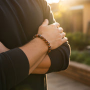 Red tiger's eye beaded stretch bracelet with sterling silver rondelle accents — a grounding, golden-hour essential that brings earthy warmth and effortless masculine style to any everyday look.