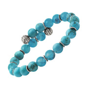 Turquoise beaded stretch bracelet with engraved sterling silver filigree ball and twisted rondelle accents.