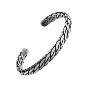 Oxidized sterling silver braided rope pattern open cuff bracelet with dark antiqued finish and tapered ends.