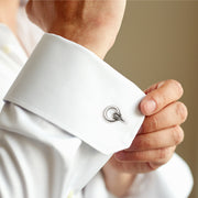 Man adjusting white French cuff dress shirt wearing sterling silver rope knot ring cufflink  Jan Leslie