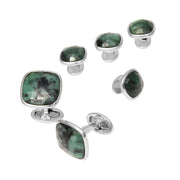 Faceted emerald cushion-cut cufflink and tuxedo stud set with silver bezel settings and double-sided backs.