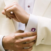 Make a lasting impression in a white tuxedo with these sterling silver bezel-set cushion-cut ruby cufflinks.