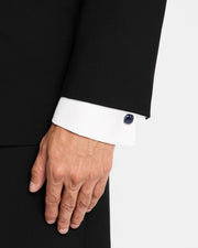 Man wearing sterling silver blue sapphire crystal cufflink on white French cuff dress shirt with black tuxedo jacket by Jan Leslie.