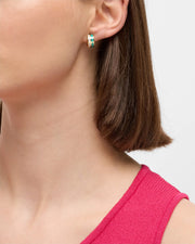 Model in pink ribbed tank wearing amazonite and pink mother-of-pearl tile inlay gold huggie hoop earrings — Jan Leslie