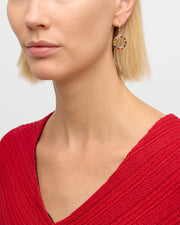 Gold-plated open circle lever-back drop earrings with mixed gemstone inlay including tiger's eye and lapis lazuli.