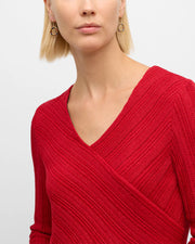 Model in red sweater wearing multicolor enamel open-circle gold drop earring — Jan Leslie