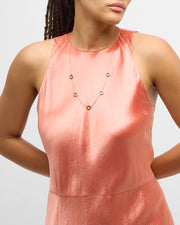 Model in coral halter dress wearing multicolor enamel five-circle station gold necklace — Jan Leslie