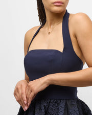 Model in navy halter dress wearing multicolor enamel open circle gold necklace — Jan Leslie