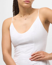Model in white V-neck cami wearing multicolor enamel open circle station gold necklace — Jan Leslie