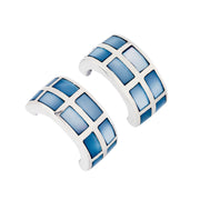 Pair of wide silver huggie hoop earrings with grid-pattern blue mother of pearl rectangular tile inlay, front-facing view
