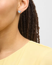"Model wearing deep blue mother-of-pearl heart inlay silver stud earring — Jan Leslie