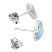 Angled view of deep blue mother-of-pearl heart inlay sterling silver stud earrings — Jan Leslie