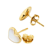 Close-up of white mother-of-pearl heart inlay gold bezel stud earrings showing iridescent surface — Jan Leslie