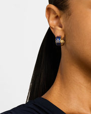 Close-up side profile of woman wearing gold vermeil sterling silver wide-band white mother of pearl floral lattice huggie hoop earring on ear with dark ponytail over burgundy top, Jan Leslie