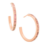 Pair of large rose gold hoop earrings with segmented white mother of pearl tile inlay.