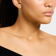 Woman wearing 18K gold vermeil lapis lazuli petal Seed of Life drop earrings showing deep royal blue lapis lazuli quatrefoil clover pendant with Seed of Life gold lattice natural gold pyrite flecks and small round lapis accent stone by Jan Leslie.