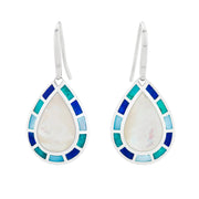 Sterling silver teardrop drop earrings with white mother-of-pearl center and multi-blue enamel mosaic tile border by Jan Leslie.