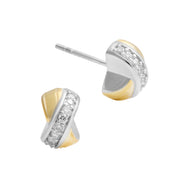 Two-tone crossover stud earrings with pavé diamond-set sterling silver band and polished gold panels.
