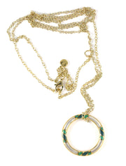 "Long gold-plated rolo chain necklace with a branded Jan Leslie lobster clasp and an open circle pendant featuring alternating white mother-of-pearl and teal enamel inlay.