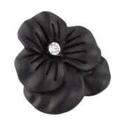 Clear crystal sculpted flower lapel pin showing faceted petal detail and sparkling center stone by Jan Leslie.