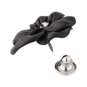 White pearl sculpted flower lapel pin with crystal center showing engraved petal detail and pin-back closure by Jan Leslie.