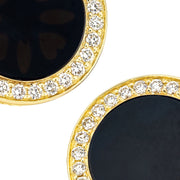 Close-up of pavé-set cubic zirconia halo surrounding polished black onyx on yellow gold round cufflinks, Jan Leslie