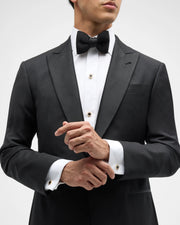 Model in black tuxedo and bow tie wearing black onyx and CZ halo yellow gold shirt studs and cufflinks — Jan Leslie
