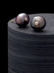 Tahitian black pearl stud earrings with bezel-set diamond accent on 14K gold post. Jan Leslie