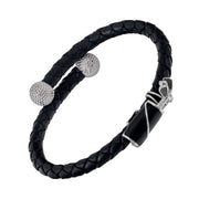 Dark brown double-strand braided leather bypass cuff bracelet with two pavé crystal golf ball end caps and black enamel golf bag clasp with silver golf club detail