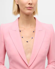 Blue lapis heart bezel stations on gold cable chain necklace, angled view — Jan Leslie