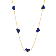 Blue lapis five-heart station necklace draped on gold cable chain — Jan Leslie