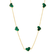 Green malachite five-heart bezel station necklace draped on gold cable chain — Jan Leslie