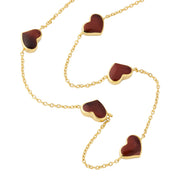 Red tiger's eye five-heart station necklace draped on gold cable chain — Jan Leslie