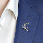 Two-tone sterling silver and gold open-work feather lapel pin — a striking, artisan-crafted accessory that adds a touch of refined elegance to any suit or blazer.