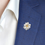 Sterling silver brushed daisy flower lapel pin with a gold granulated center — a charming, nature-inspired accessory to brighten any suit or blazer.