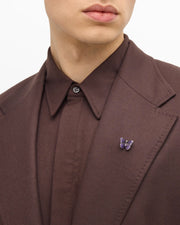 Purple and blue enamel butterfly sterling silver lapel pin worn on brown suit lapel with brown dress shirt