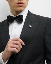 Red and coral enamel butterfly sterling silver lapel pin worn on black tuxedo