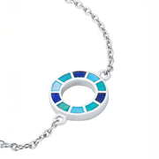 Sterling silver open circle pendant necklace with segmented navy, teal, turquoise, and sky blue enamel mosaic detail on cable chain.