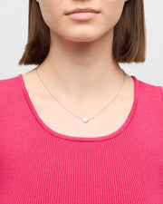 Model in rust tweed top wearing blue mother-of-pearl heart pendant sterling silver necklace — Jan Leslie