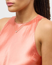 Model in coral satin tank wearing white mother-of-pearl heart pendant gold necklace — Jan Leslie