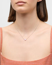 Model in rust orange dress wearing pink mother-of-pearl heart pendant sterling silver necklace — Jan Leslie
