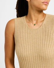 Model in beige ribbed sweater wearing lapis lazuli quatrefoil gold pendant necklace — Jan Leslie