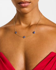 Model wearing blue lapis clover station necklace on gold chain — Jan Leslie